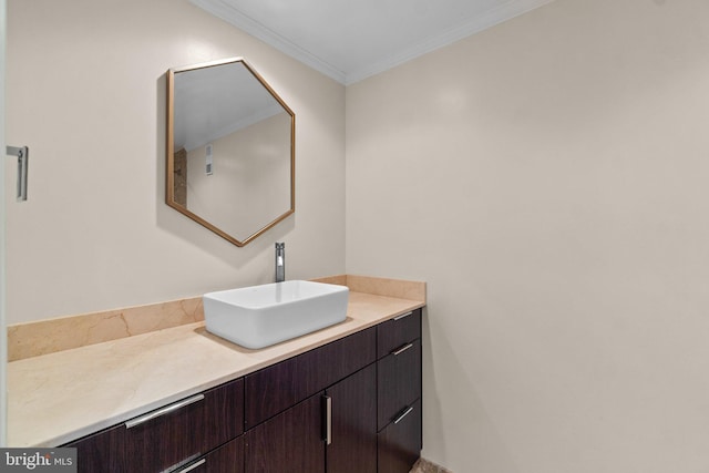 bathroom with crown molding and vanity