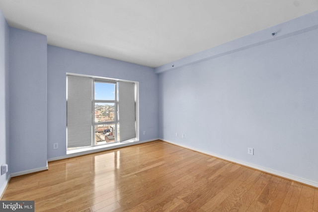 empty room with light wood-type flooring