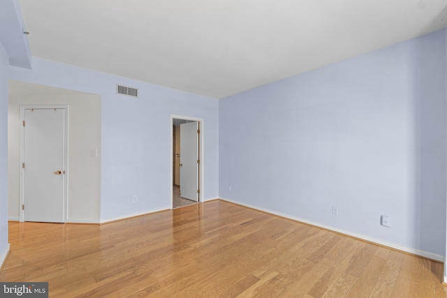 unfurnished room with light hardwood / wood-style floors