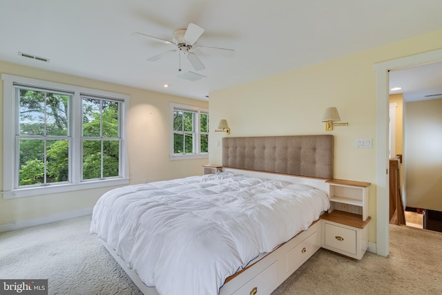 bedroom featuring ceiling fan and light colored carpet