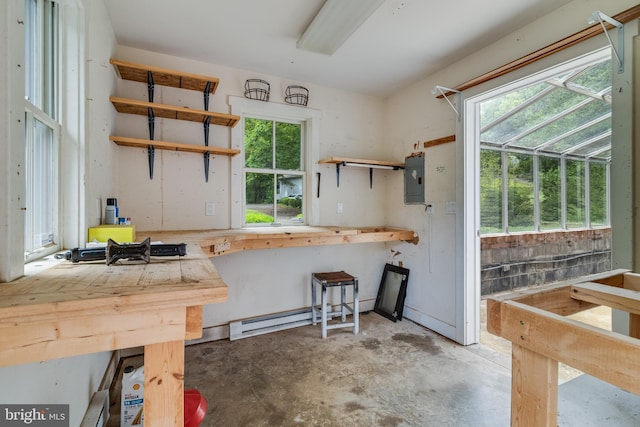 kitchen with a baseboard radiator and concrete floors