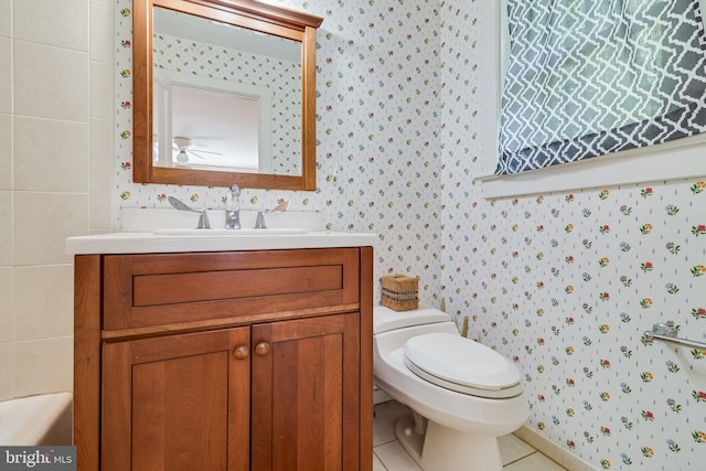 bathroom featuring tile patterned floors, vanity, and toilet