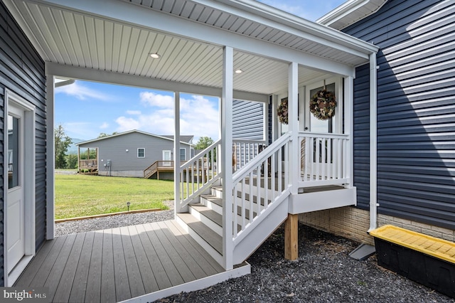 wooden deck with a yard