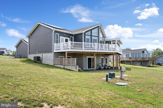 back of house featuring a wooden deck, a yard, and cooling unit