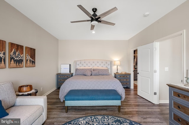 bedroom with ceiling fan and dark hardwood / wood-style flooring