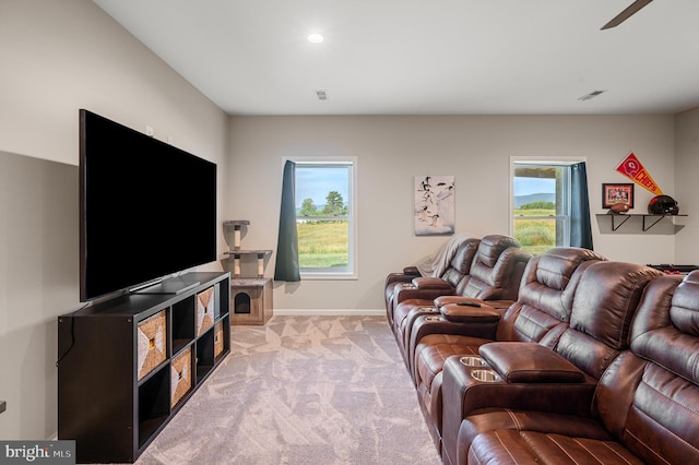 living room featuring a healthy amount of sunlight and light carpet