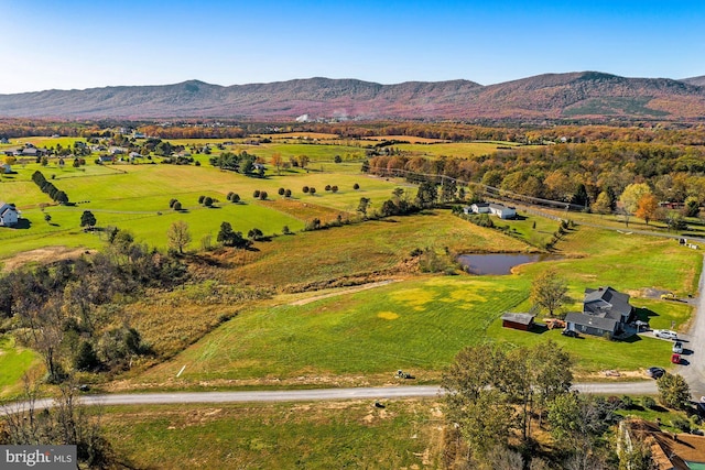 drone / aerial view featuring a mountain view and a rural view