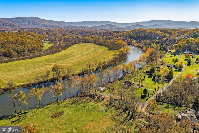 drone / aerial view featuring a water and mountain view