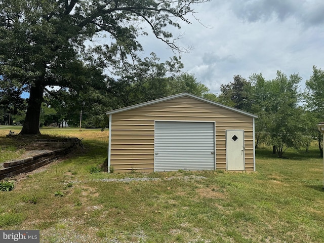 garage featuring a yard