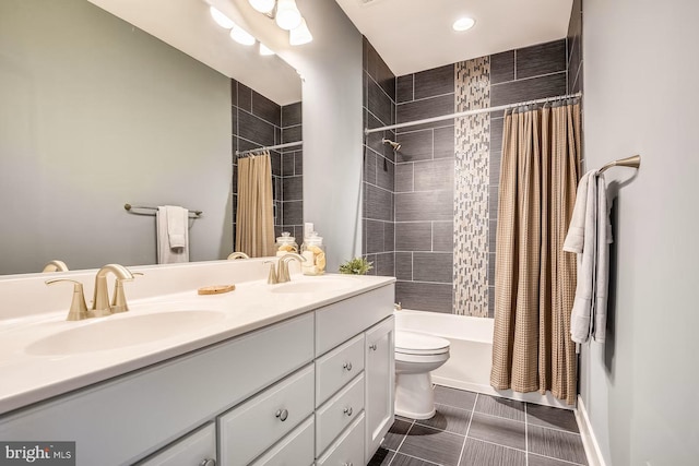 full bathroom featuring tile patterned flooring, vanity, shower / bath combo, and toilet