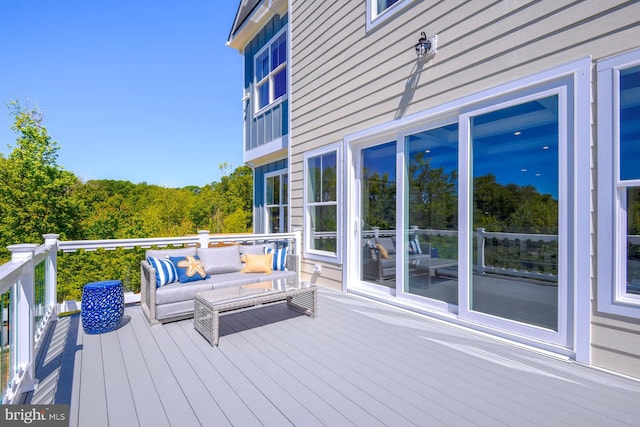 wooden deck featuring an outdoor living space