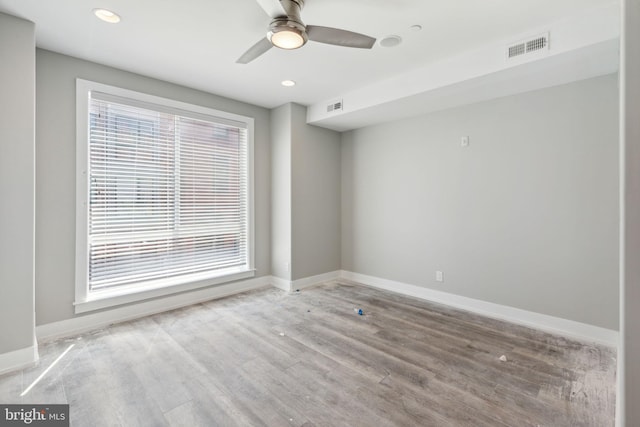 unfurnished room featuring hardwood / wood-style floors and ceiling fan