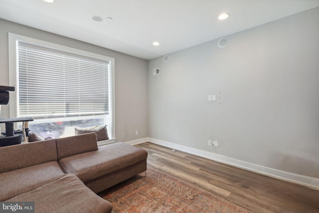 living room with dark hardwood / wood-style floors