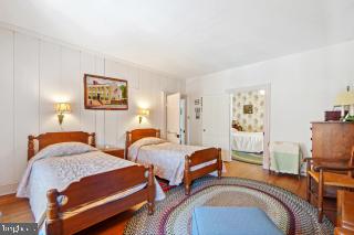 bedroom featuring wood-type flooring