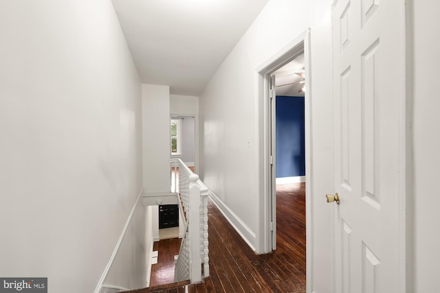 hall with dark hardwood / wood-style floors