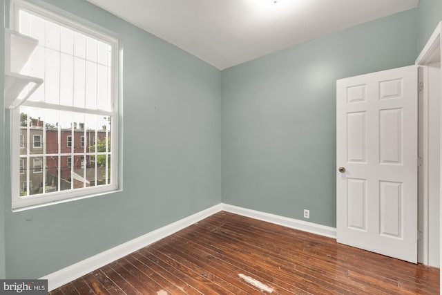 spare room with hardwood / wood-style floors