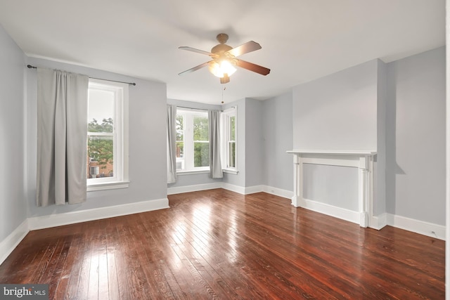 empty room with hardwood / wood-style flooring and ceiling fan