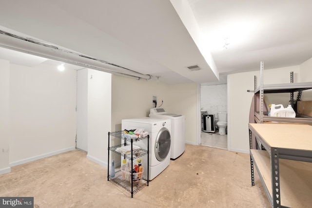 washroom with washing machine and dryer