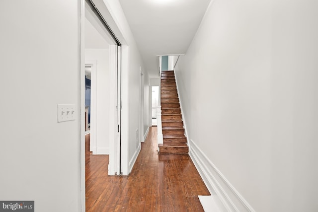 hallway featuring hardwood / wood-style flooring