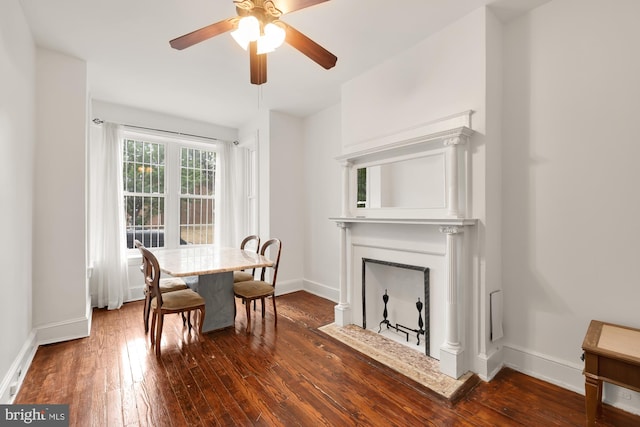 dining room with hardwood / wood-style floors and ceiling fan