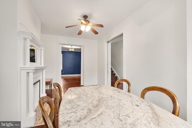 dining area featuring ceiling fan and wood-type flooring