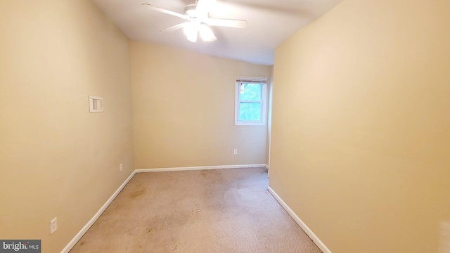 spare room with ceiling fan