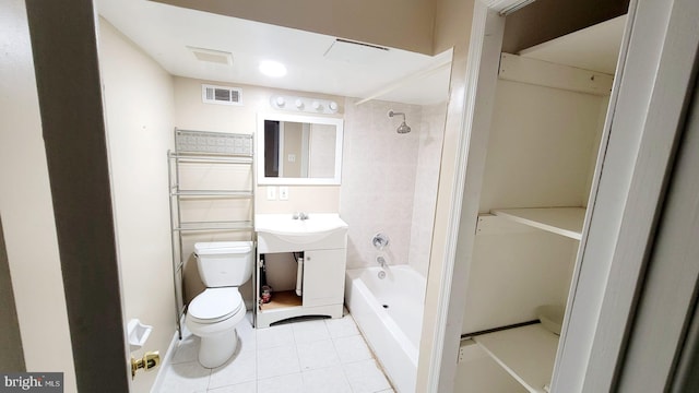 full bathroom with tiled shower / bath combo, tile patterned floors, vanity, and toilet