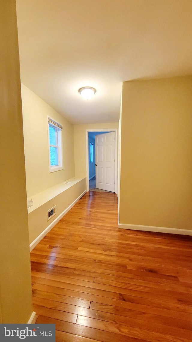 spare room with light hardwood / wood-style floors