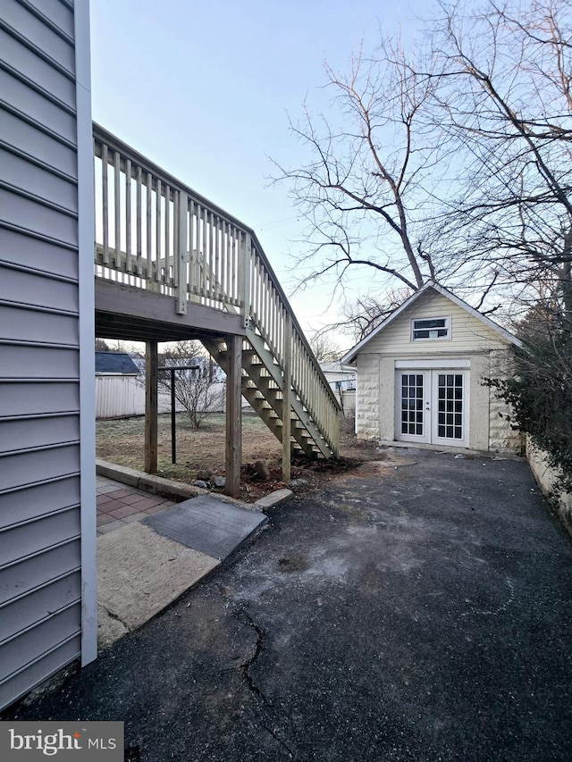 exterior space with an outdoor structure and french doors