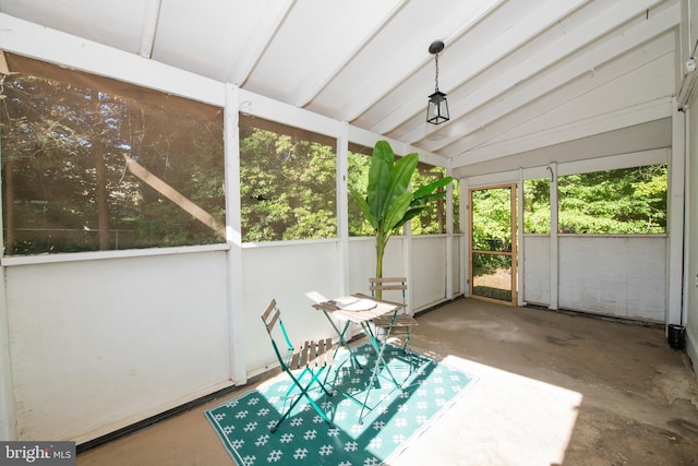 unfurnished sunroom featuring lofted ceiling