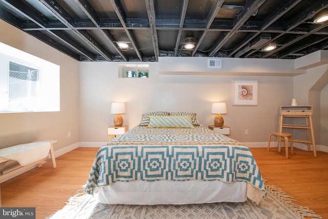 bedroom featuring wood-type flooring