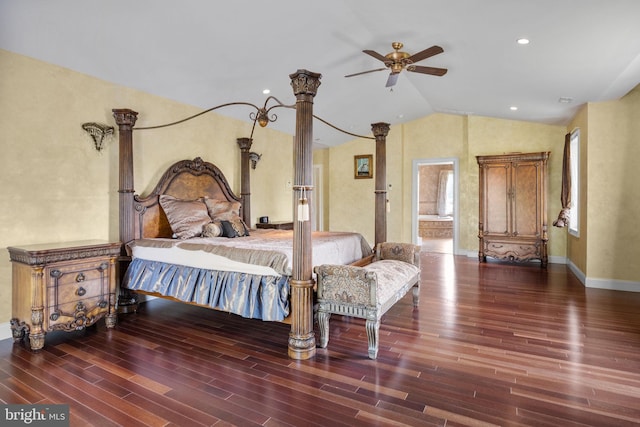 bedroom featuring ensuite bath, ceiling fan, dark wood-type flooring, and vaulted ceiling