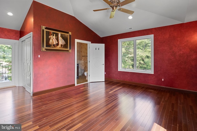 spare room featuring hardwood / wood-style flooring, vaulted ceiling, and ceiling fan