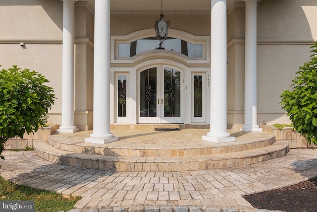 property entrance featuring french doors and a porch