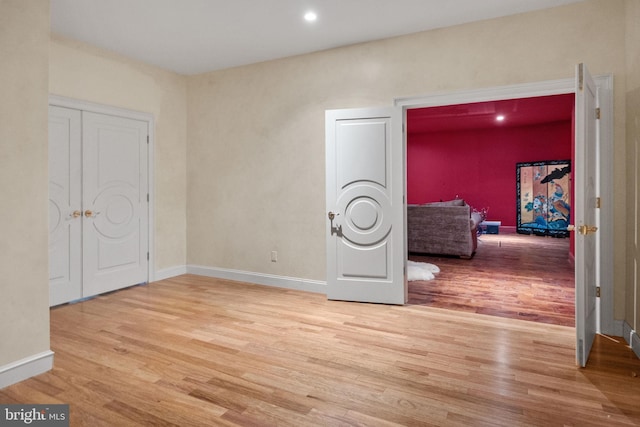 empty room with light hardwood / wood-style floors