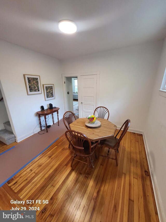 dining space featuring hardwood / wood-style flooring