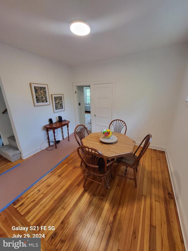 dining space featuring wood-type flooring