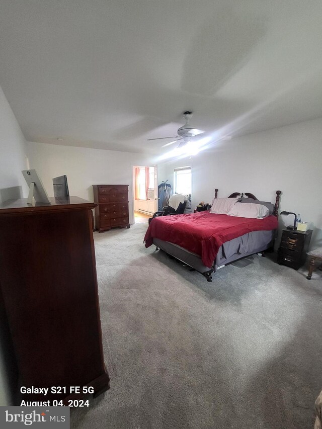 full bathroom with tiled shower / bath combo, radiator, tile patterned floors, vanity, and toilet