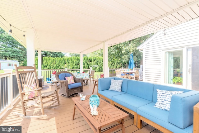 deck featuring an outdoor hangout area and outdoor dining area