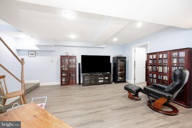 living room with light wood finished floors, baseboards, stairway, and recessed lighting