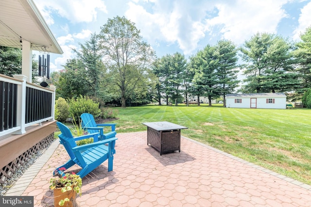 view of patio / terrace with an outbuilding