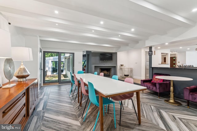 dining room featuring parquet floors and beam ceiling