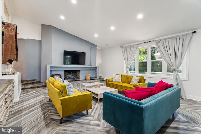 living room with lofted ceiling and parquet flooring