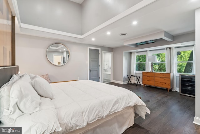 bedroom featuring dark wood-type flooring and a closet