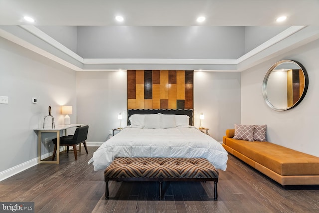 bedroom featuring a towering ceiling and dark wood-type flooring