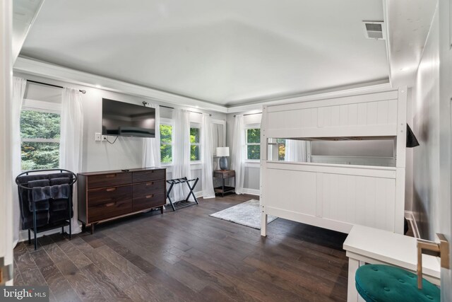 bedroom featuring dark hardwood / wood-style flooring and ornamental molding