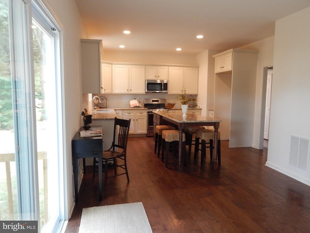 dining room featuring dark hardwood / wood-style flooring and sink