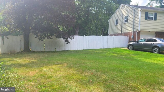 view of yard with a garage