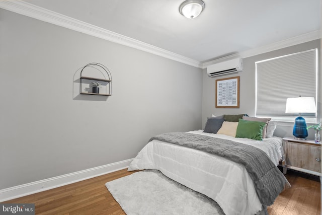 bedroom with a wall unit AC, dark wood-type flooring, and ornamental molding