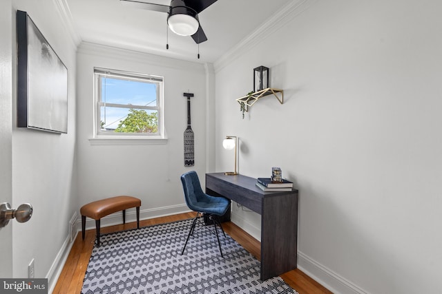 home office with hardwood / wood-style floors, ceiling fan, and ornamental molding